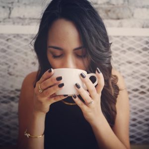 woman drinking with cup